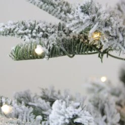 Northlight Real Touch™️ Pre-Lit Slim Flocked Nordmann Fir Artificial Christmas Tree - 4.5' - Warm Clear LED Lights Green -Northlight 4612147798880817824