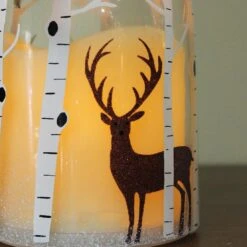 Northlight 10" LED Flameless Pillar Candle In A Clear Glass Bottle Lantern With Deer Accents -Northlight 4612200956335899872